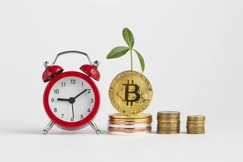 Bitcoin piles alarm clock Stock Photos