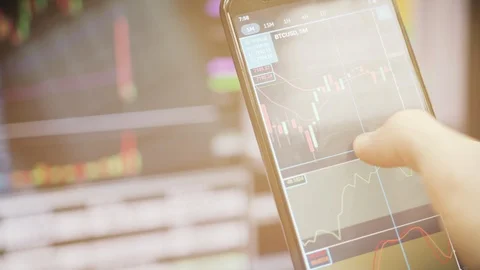 Bitcoin price chart on digital exchange on mobile phone screen. Stock Footage 121962724