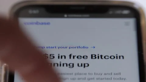 Bitcoin Price - Crypto: Looking At Coinbase On An Iphone Stock Footage 152051059