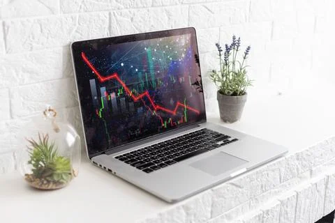 Bitcoin price is falling down and the entire crypto currency market is loosing Stock Photos