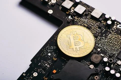 Bitcoin on a processor Stock Photos