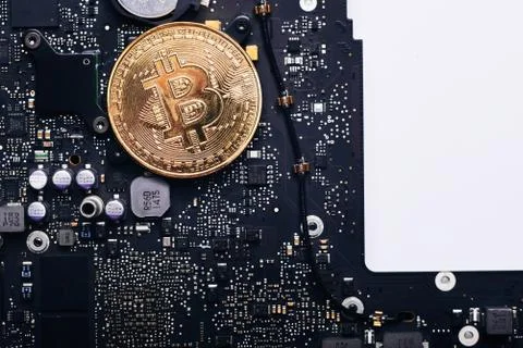 Bitcoin on a processor Stock Photos