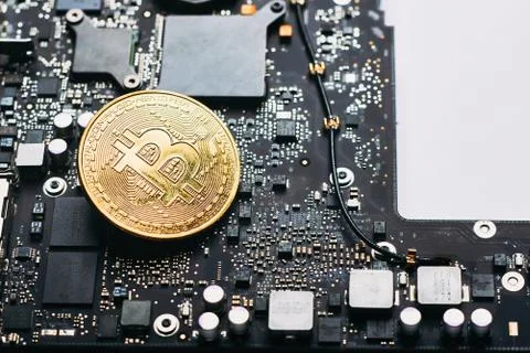Bitcoin on a processor Stock Photos