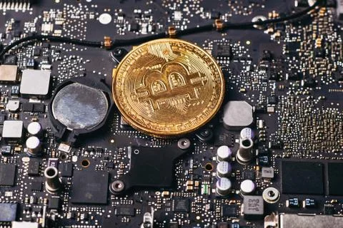 Bitcoin on a processor Stock Photos
