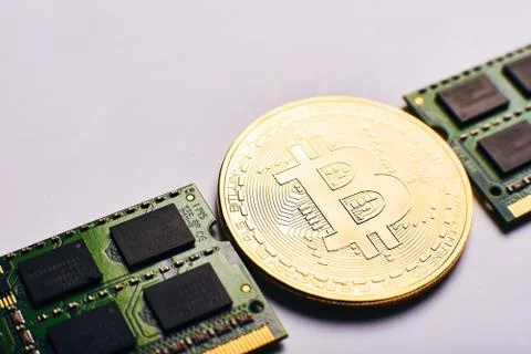 Bitcoin on a processor Stock Photos