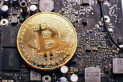 Bitcoin on a processor Stock Photos