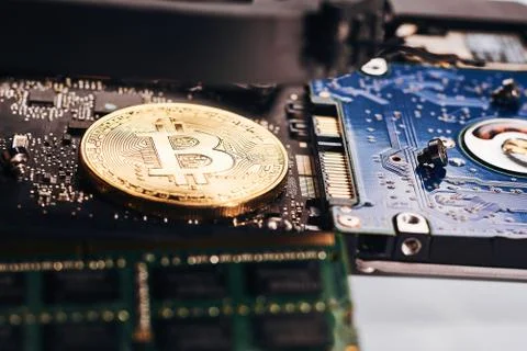 Bitcoin on a processor Stock Photos