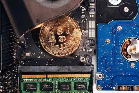 Bitcoin on a processor Stock Photos