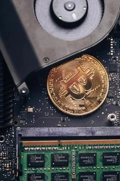 Bitcoin on a processor Stock Photos