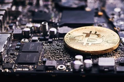 Bitcoin on a processor Stock Photos