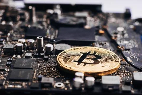 Bitcoin on a processor Stock Photos
