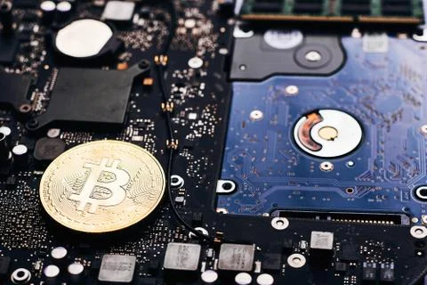 Bitcoin on a processor Stock Photos