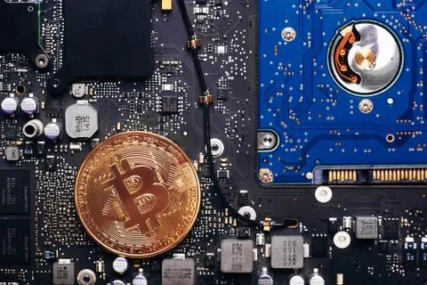Bitcoin on a processor Stock Photos