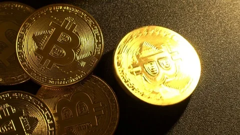 Bitcoin revolves on black background Stock Footage 84215765