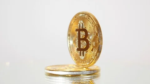 Bitcoin revolves on white background Stock Footage 88329554
