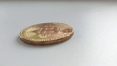 Bitcoin rises and spinning in slow motion on a white background Stock Footage 95978118