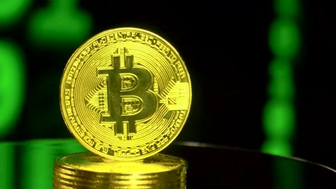 Bitcoin rotating on binary code blockchain background Stock Footage 170516616