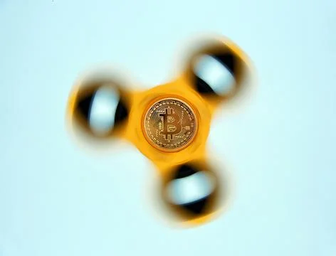 Bitcoin on rotating display on white background. New technological economy Stock Photos