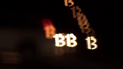 Bitcoin shaped bokeh of car lights at night. Stock Footage 80959315