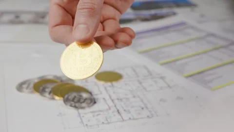 A bitcoin is shown in the hand Stock Footage 305635267