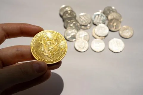 Bitcoin with silver coins background Stock Photos