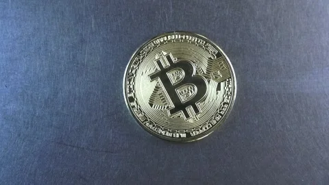 Bitcoin slides on a metal surface Stock Footage 152926660