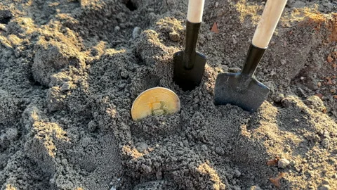 Bitcoin in soil after extraction. Сryptocurrency trading exchange. Stock-Footage 269902724