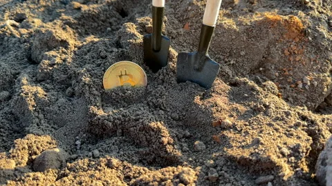 Bitcoin in soil after extraction. Сryptocurrency trading exchange. Stock-Footage 269902792