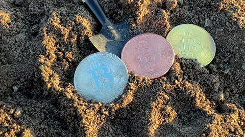 Bitcoin in soil after extraction. Сryptocurrency trading exchange. Stock-Footage 269902964
