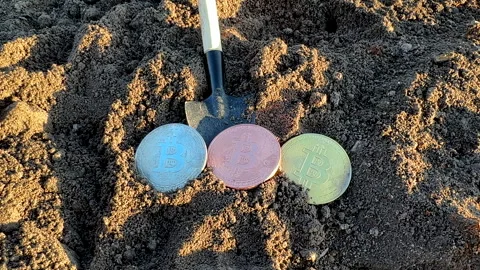 Bitcoin in soil after extraction. Сryptocurrency trading exchange. Stock-Footage 269903067