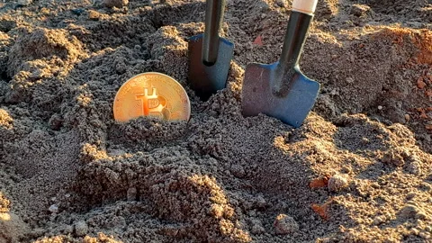 Bitcoin in soil in extraction. Ethereum, ETH coins mining in ground Stock-Footage 269902798