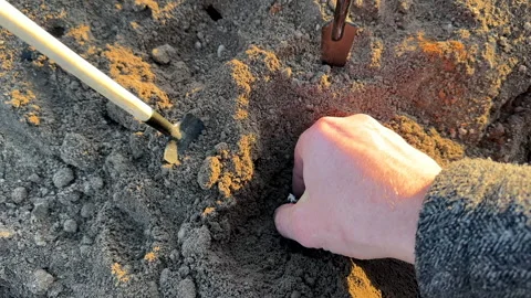 Bitcoin in soil in extraction. Ethereum, ETH coins mining in ground Stock Footage 269904356