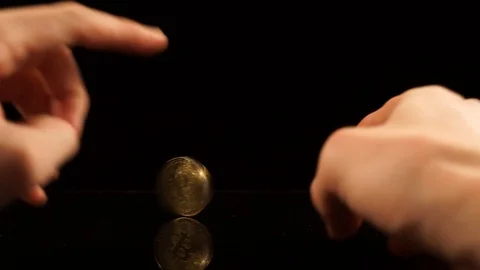 Bitcoin spin on a black mirror table Stock Footage 88717194