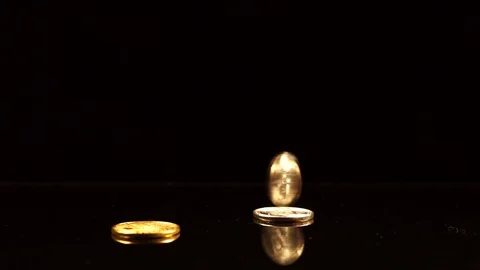 Bitcoin spin on a black mirror table Stock Footage 100332164