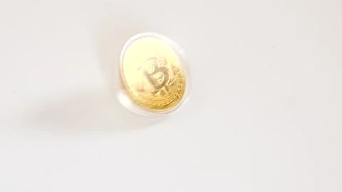 Bitcoin spinning on table Stock Footage 140940851