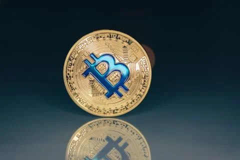 Bitcoin stand on glass table Stock Photos