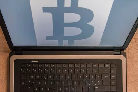 Bitcoin symbol on notebook Stock Photos