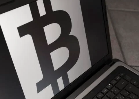 Bitcoin symbol on notebook Stock Photos