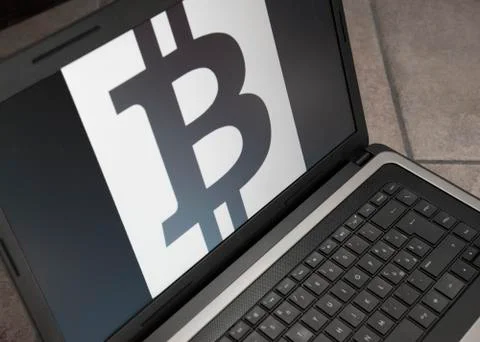 Bitcoin symbol on notebook Stock Photos