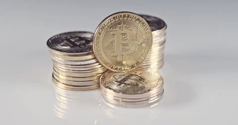 Bitcoin symbol rotating on marble table. BTC golden money spinning around. Stock Footage 220091445