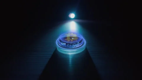 Bitcoin on the table with a graphical interface. Bitcoin digital currency. Stock Footage 168469274