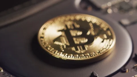 Bitcoin on top of a motherboard computer chip. Cryptocurrency and Fintech. Stock Footage 122670490