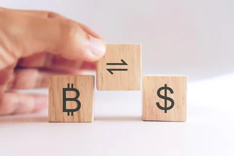Bitcoin trade or exchange to dollar sign in stock market on wooden cube with  Stock Photos