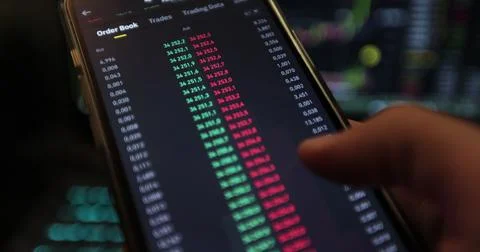 Bitcoin trading with price evolution. View at app on the screen of the laptop Stock Photos
