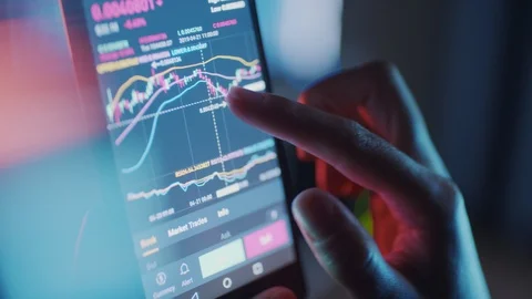 Bitcoin trading on a smart phone Video stock 107078501