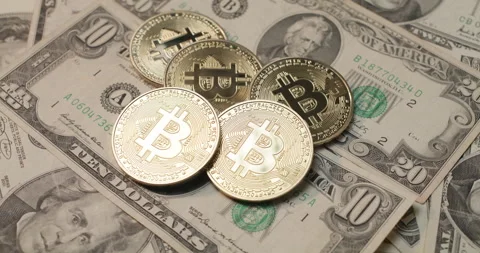 Bitcoin on US Dollar Banknotes. USD and BTC currency Stock Footage 177138027