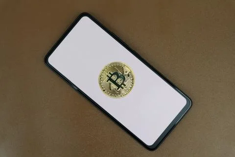 Bitcoin on a white smartphone screen Stock Photos
