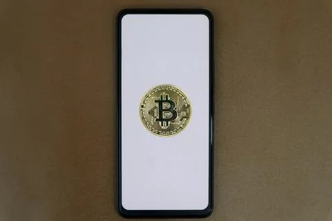 Bitcoin on a white smartphone screen Stock Photos