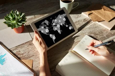 Bitcoin world map and blockchain technology concept on screen. Фото