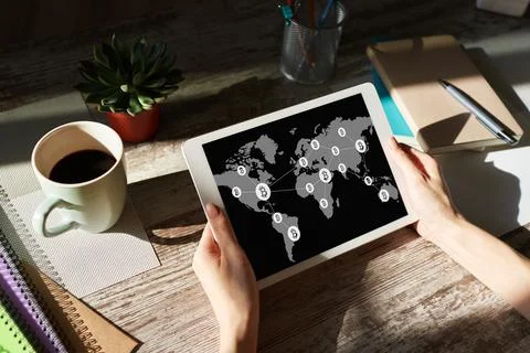 Bitcoin world map and blockchain technology concept on screen. Фото